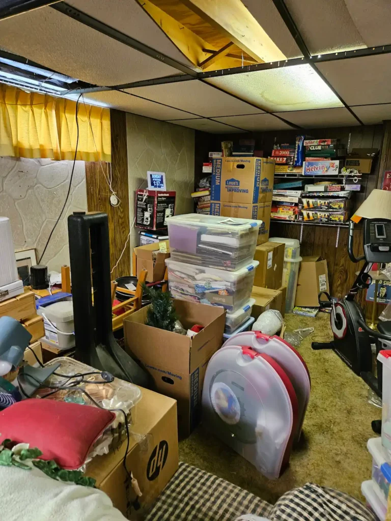 cluttered basement, packed basement, board games, christmas decor, home clear out, declutter