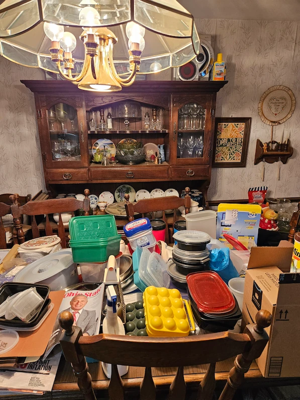 cluttered dining room, china hutch, plastic containers, home clear out, declutter