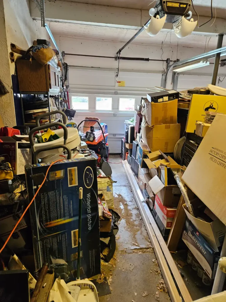 cluttered garage, packed garage, tools, workbench, boxes, home clear out, declutter