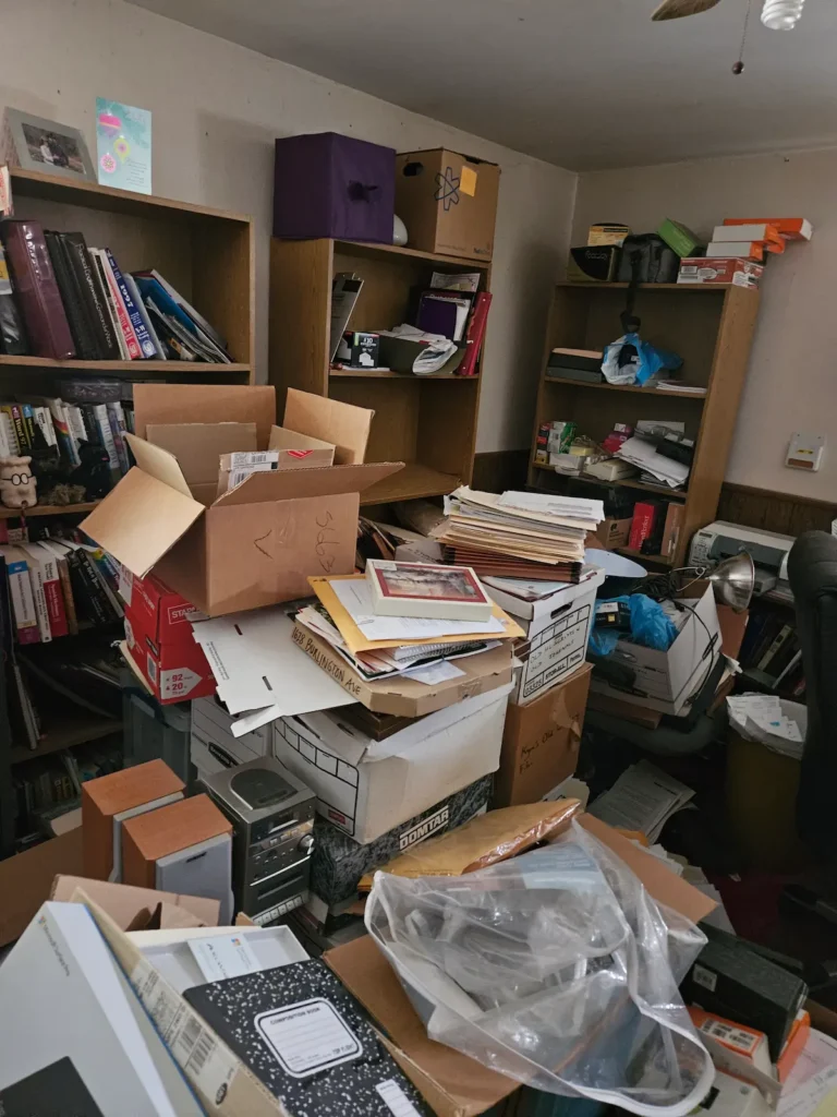 packed office, cluttered office, boxes, papers, cluttered shelves, home clear out, declutter