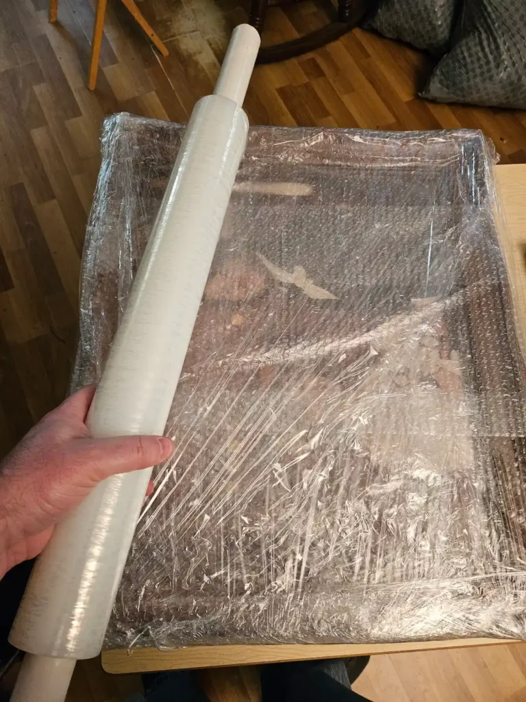 using pallet wrap and bubble wrap to wrap framed pictures